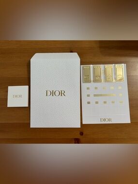 Dior bookmark set in gold tone. 4 piece luxurious
